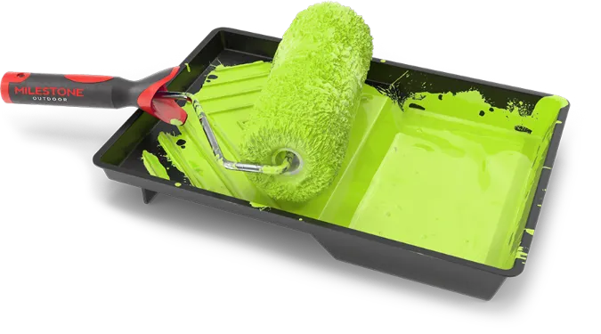 paint roller in tray with green paint